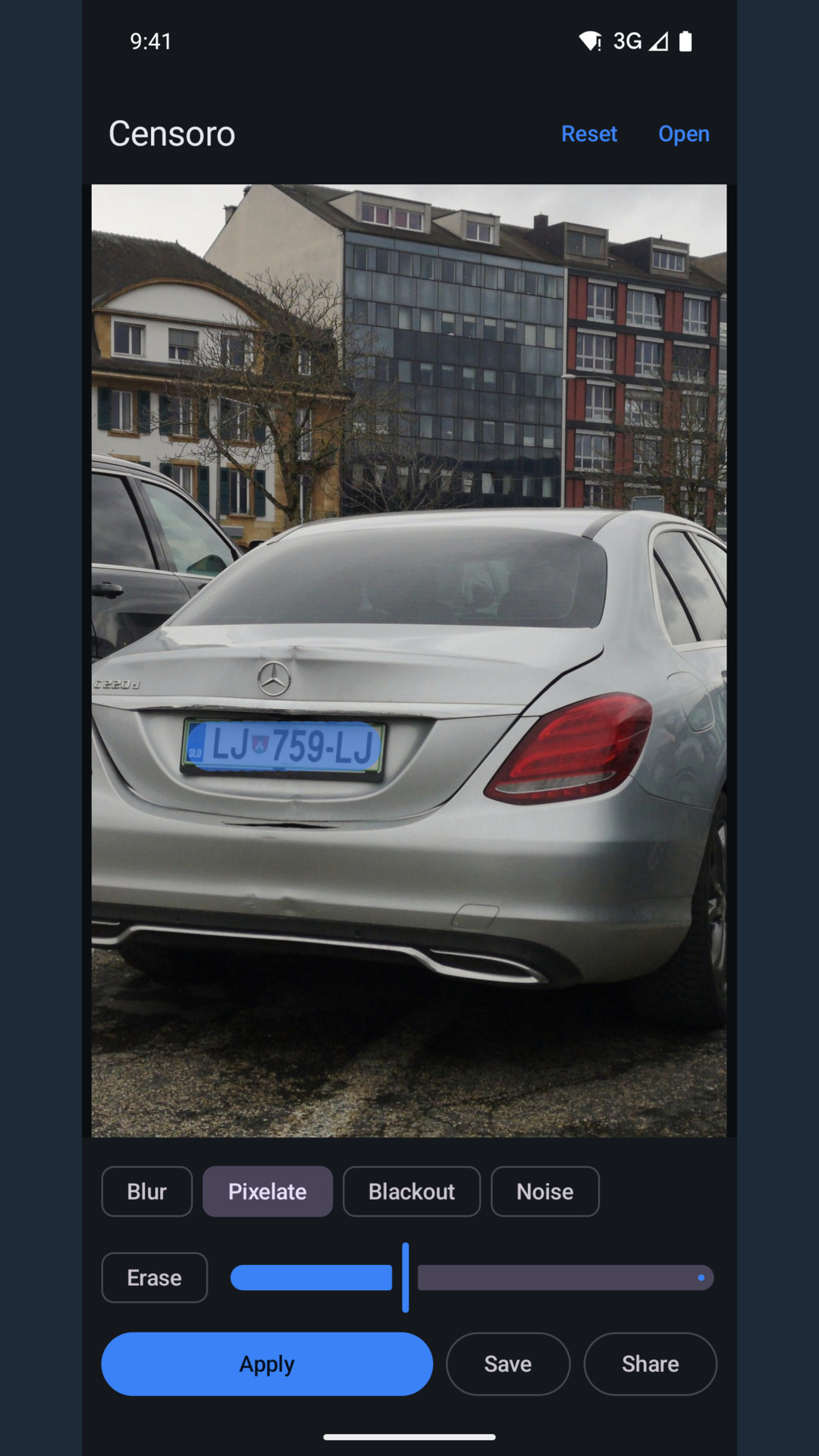 A car's number plate covered with blue brush strokes, Pixelate selected in the effect row.