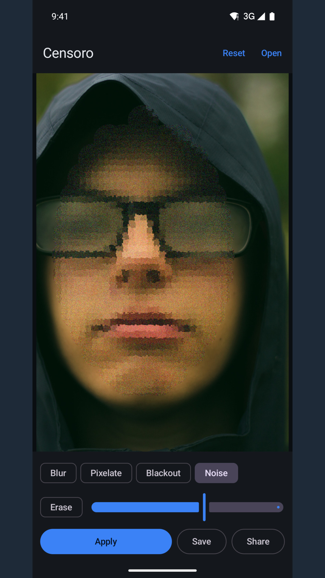 A face close-up covered with grain from the Noise effect, glasses still visible under it.
